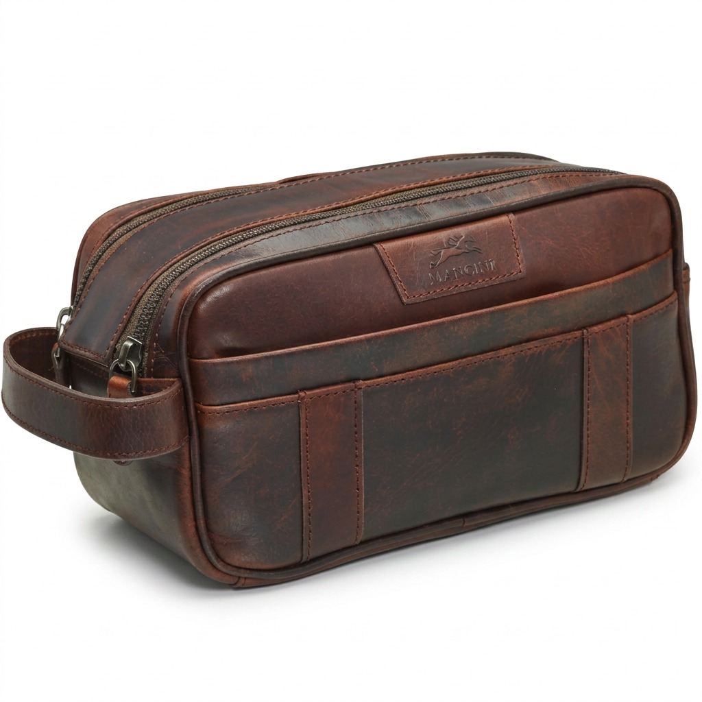 A rich brown leather Mancini toiletry bag with two main zippered compartments and side handle.